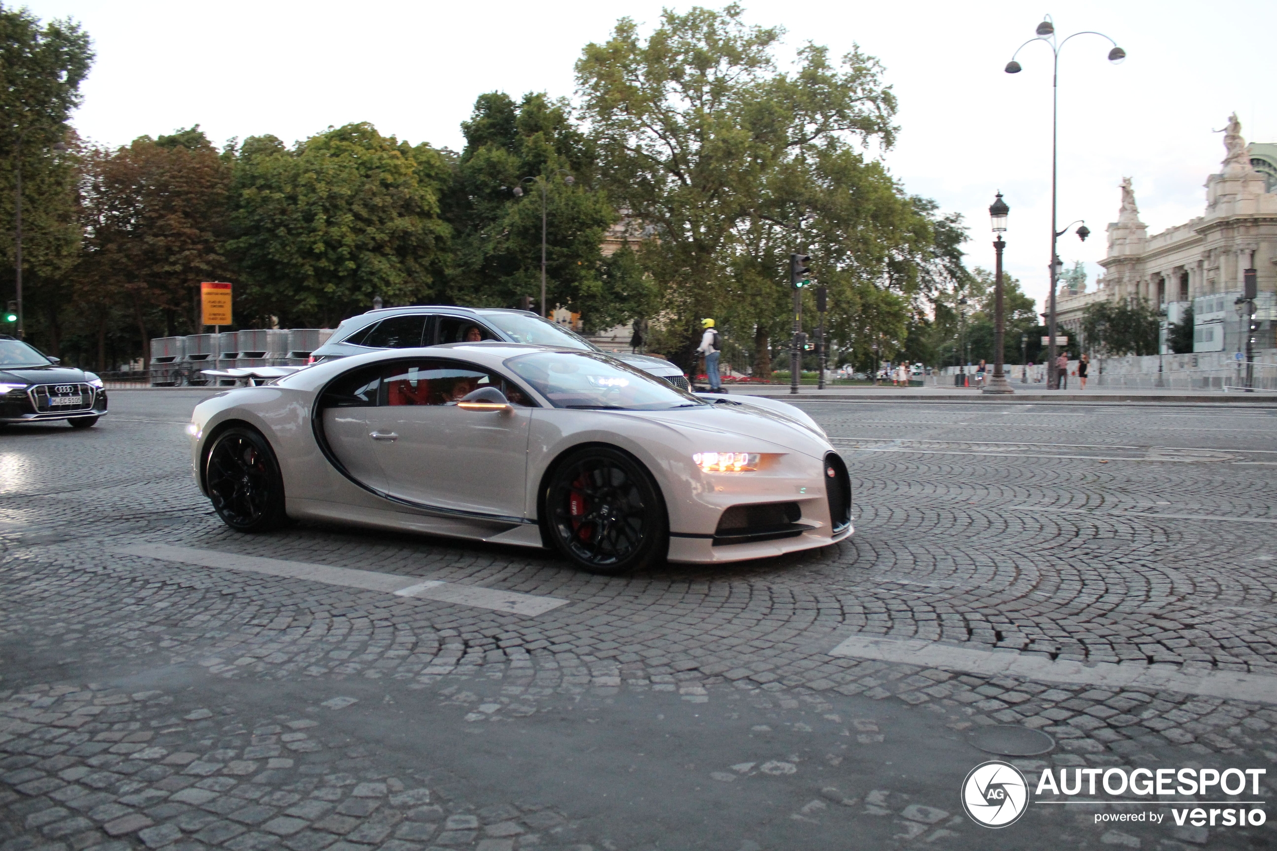 A Chiron shows up in paris during a beautiful sunset